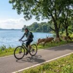 Traveler riding a bicycle near Bhojtal lake inside Van Vihar National Park Bhopal Madhya Pradesh India